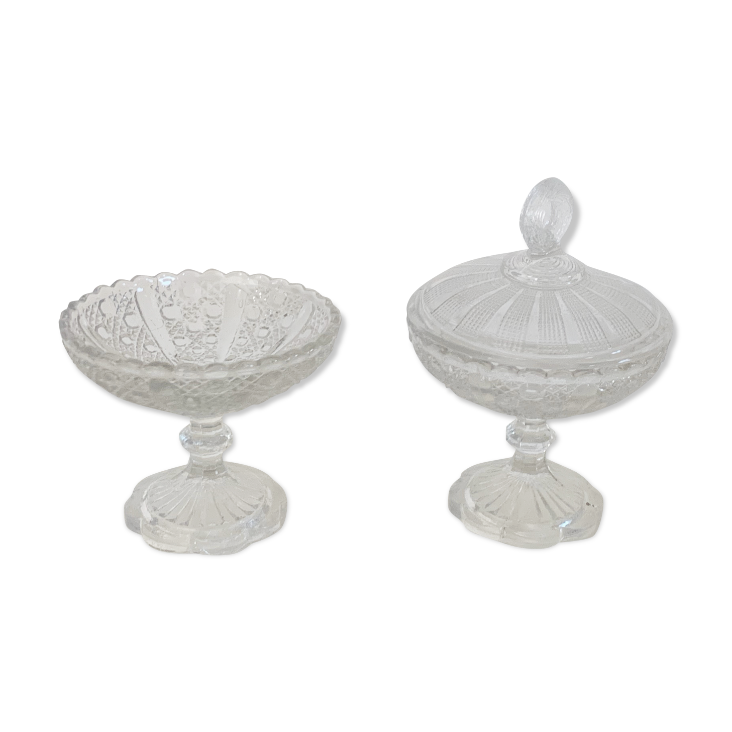 Two dredged cups in transparent glass geometric patterns in old relief