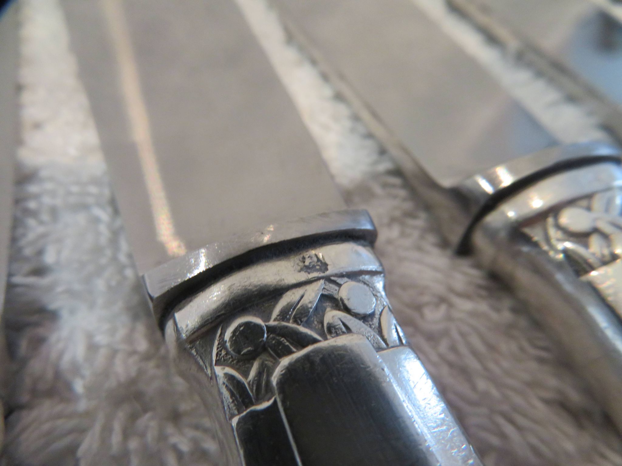 12 silver plated table knives by Argit goldsmith? Art Deco floral bands