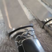 12 silver plated table knives by Argit goldsmith? Art Deco floral bands