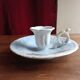 Antique handheld candle holder in porcelain