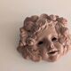 Vintage terracotta wall mask - flowery child's face