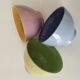 Set of three pastel two-tone mini bowls in glazed ceramic.