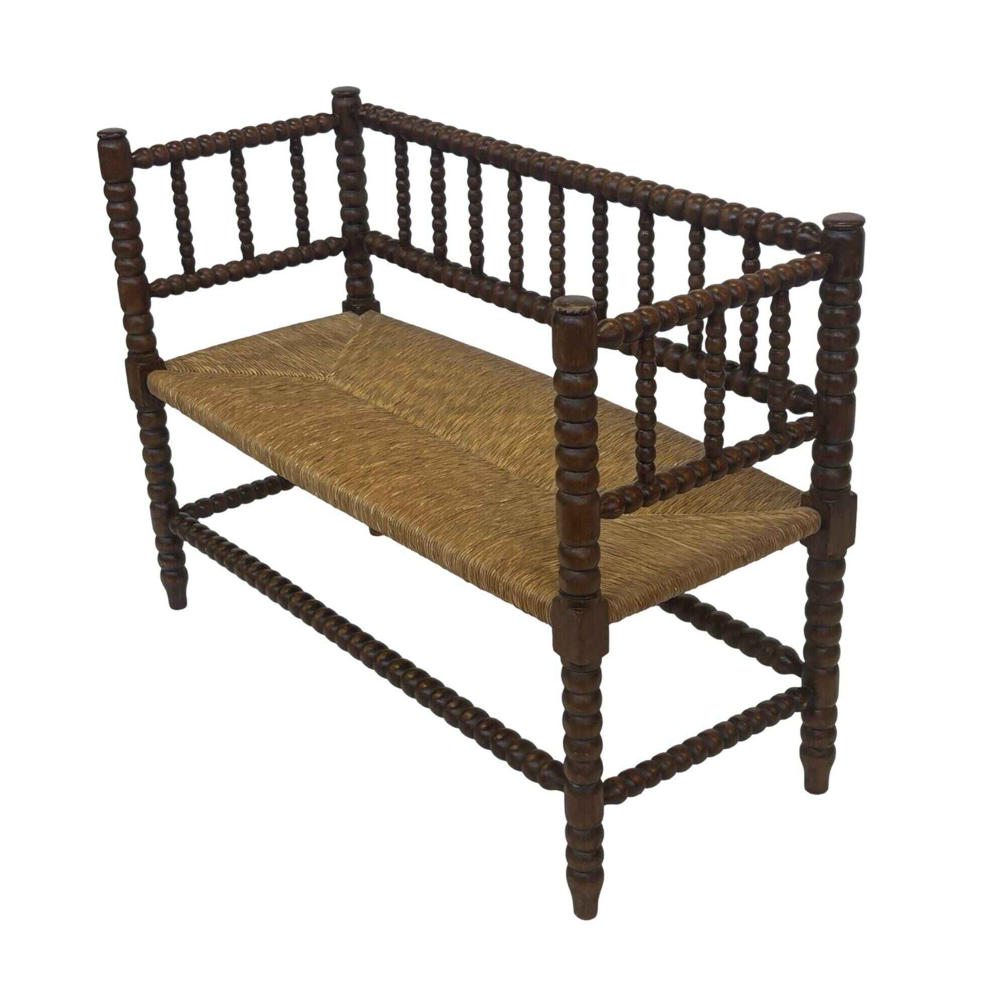 Vintage 'bobbin' bench with a rush seat, 1920s design with armrests.