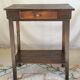 Old country side table in waxed wood