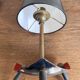 1950s modernist tripod lamp made of sheet metal and brass.