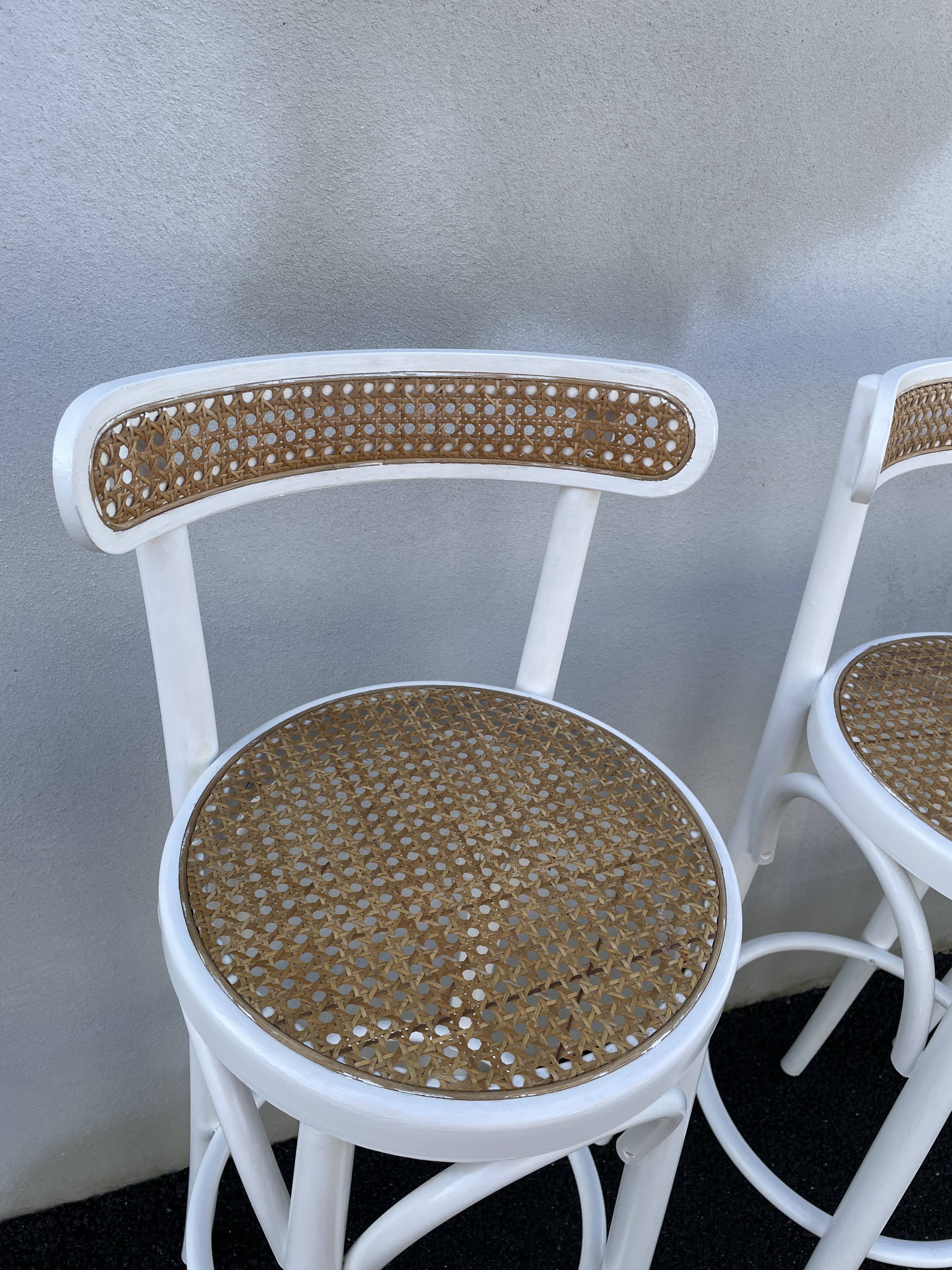 High stools in cane and curved wood 1970-1980