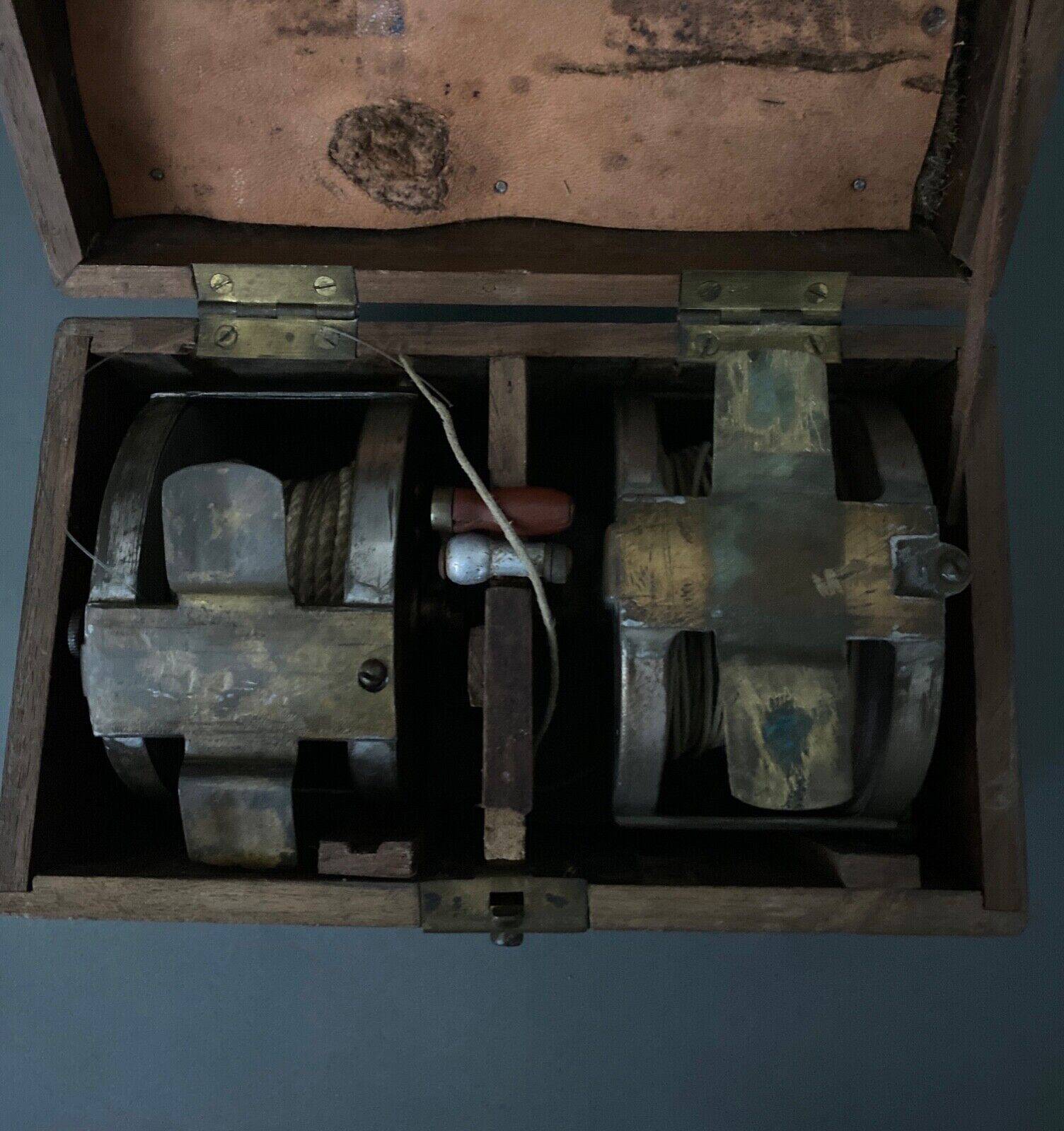 Two reel spools in their original 1900 box