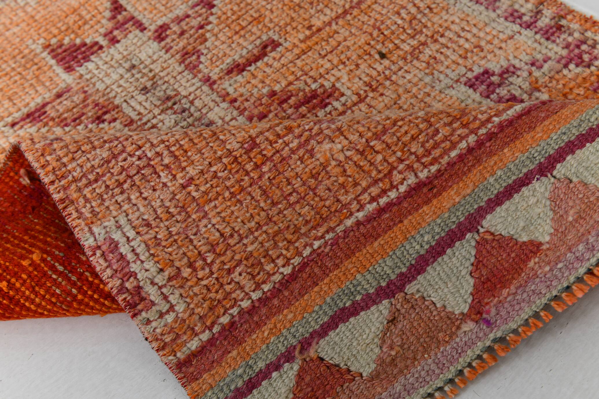 2x12 shades of pale orange vintage runner rug