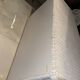 White rattan bedroom set: chest of drawers, mirror, bed, basket
