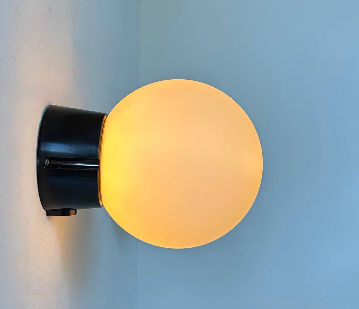 Pair of vintage Raak opaline and Bakelite wall lights, Netherlands 1970s