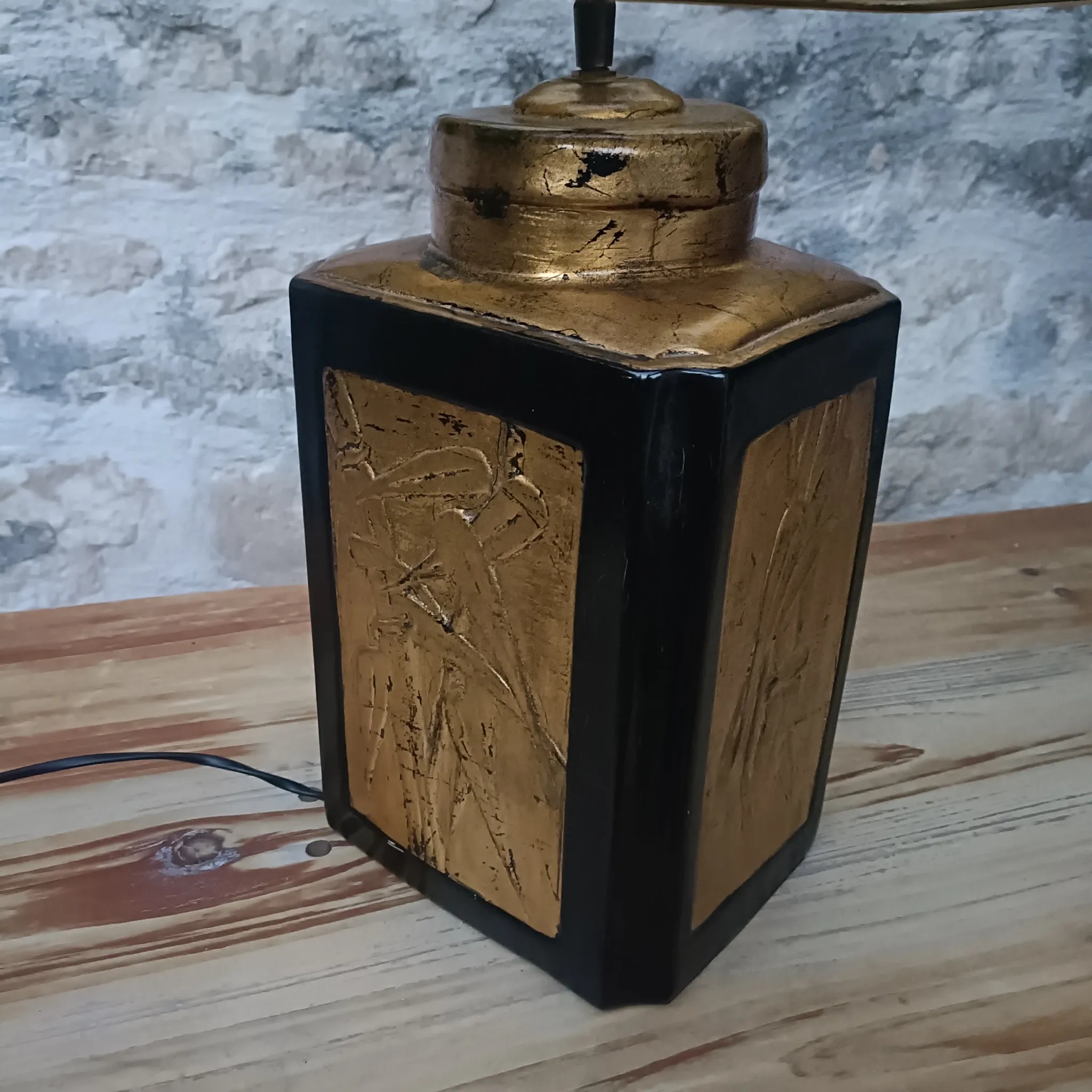 Large ceramic lamp with an Asian theme.