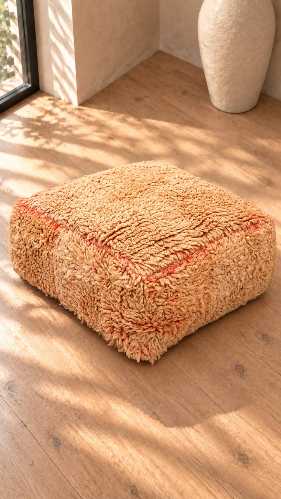 Vintage Berber pouf in natural wool – salmon and beige