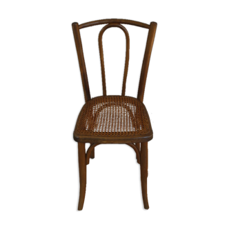Curved wooden and caning bistro chair