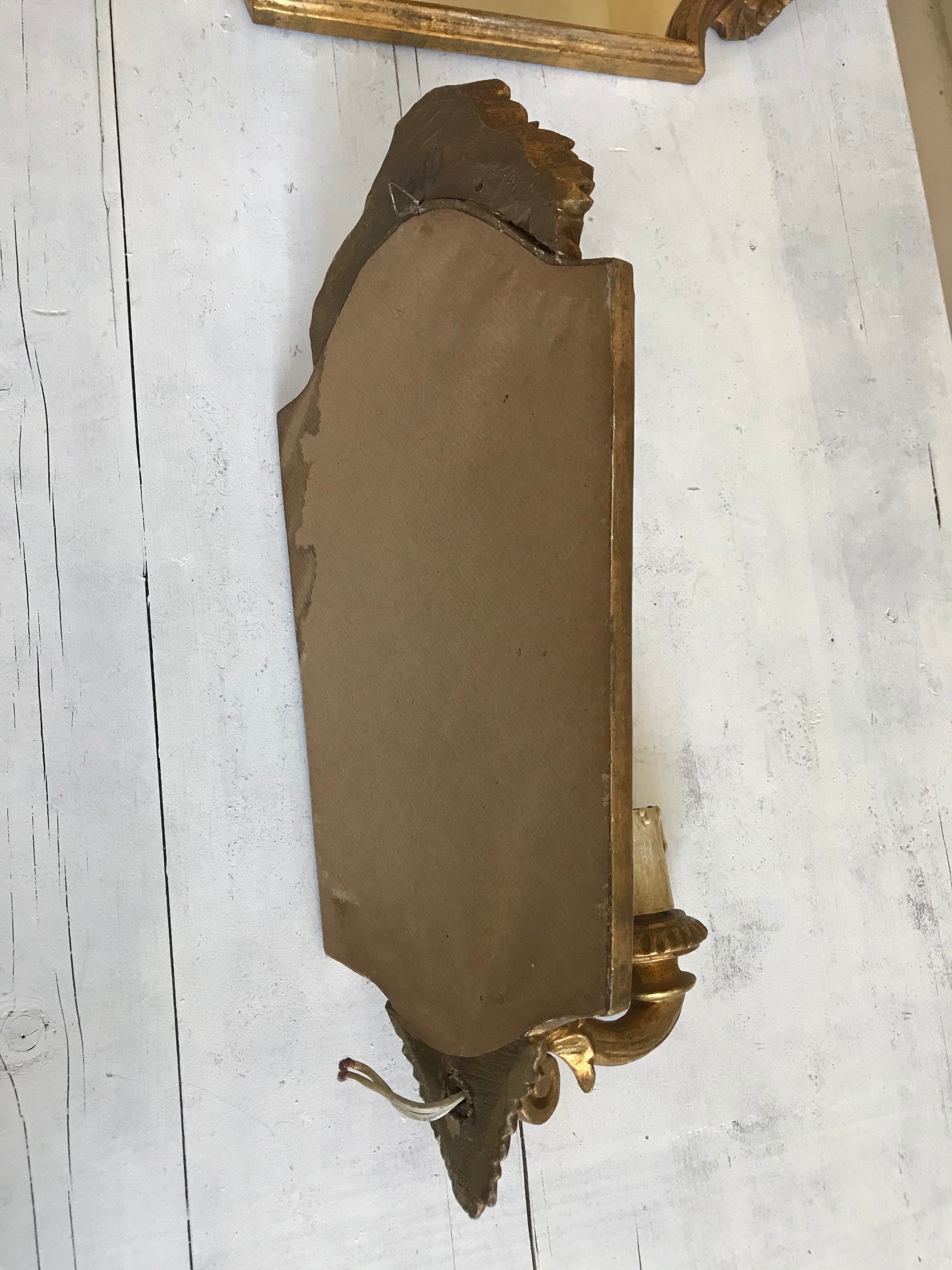 Pair of florentine wall lamps