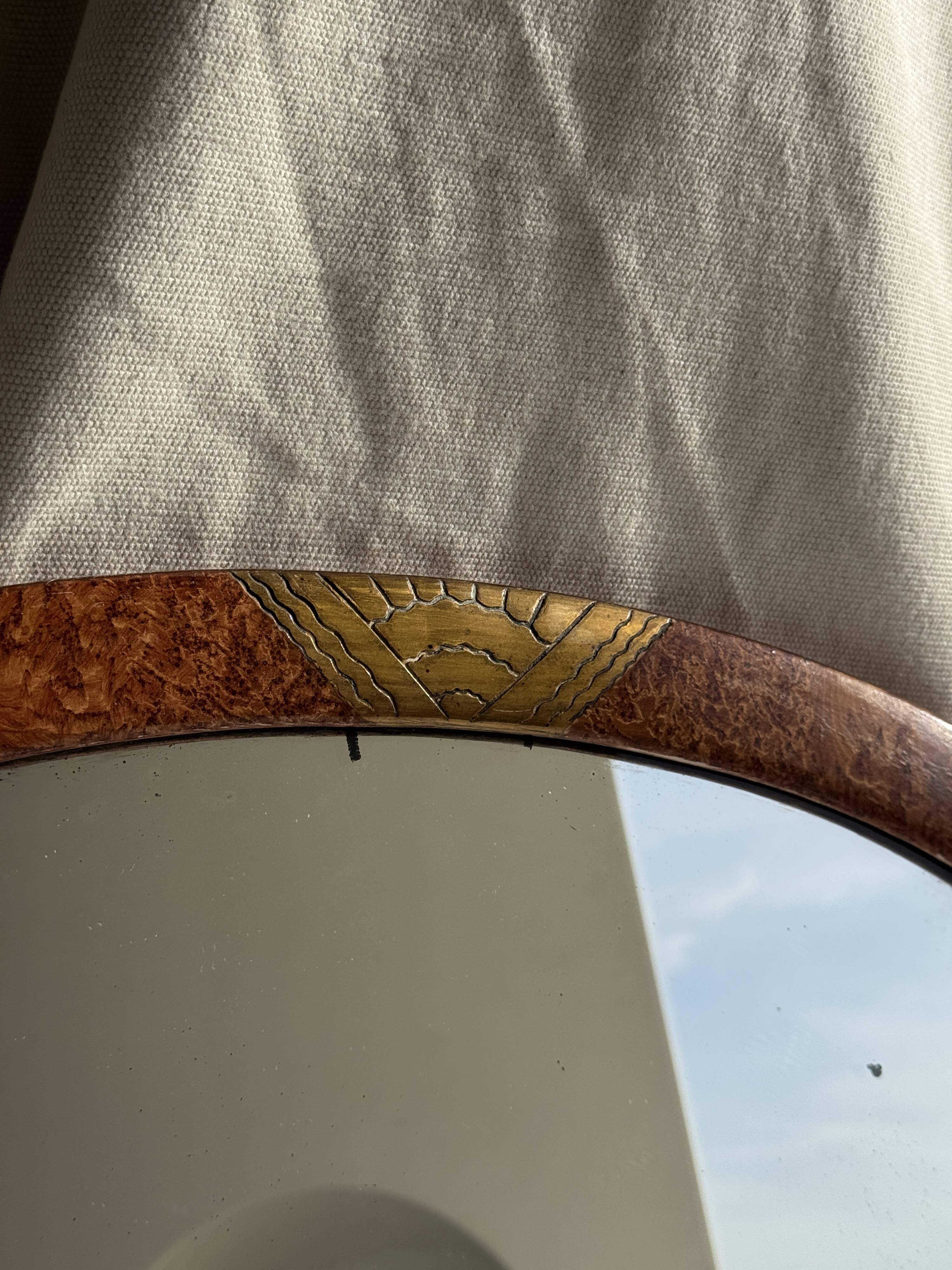 Small oval Art Deco mirror in brown and gold 33x54.