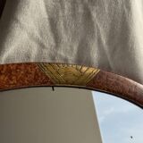 Small oval Art Deco mirror in brown and gold 33x54.