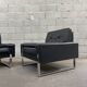 Pair of black leather armchairs