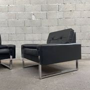 Pair of black leather armchairs