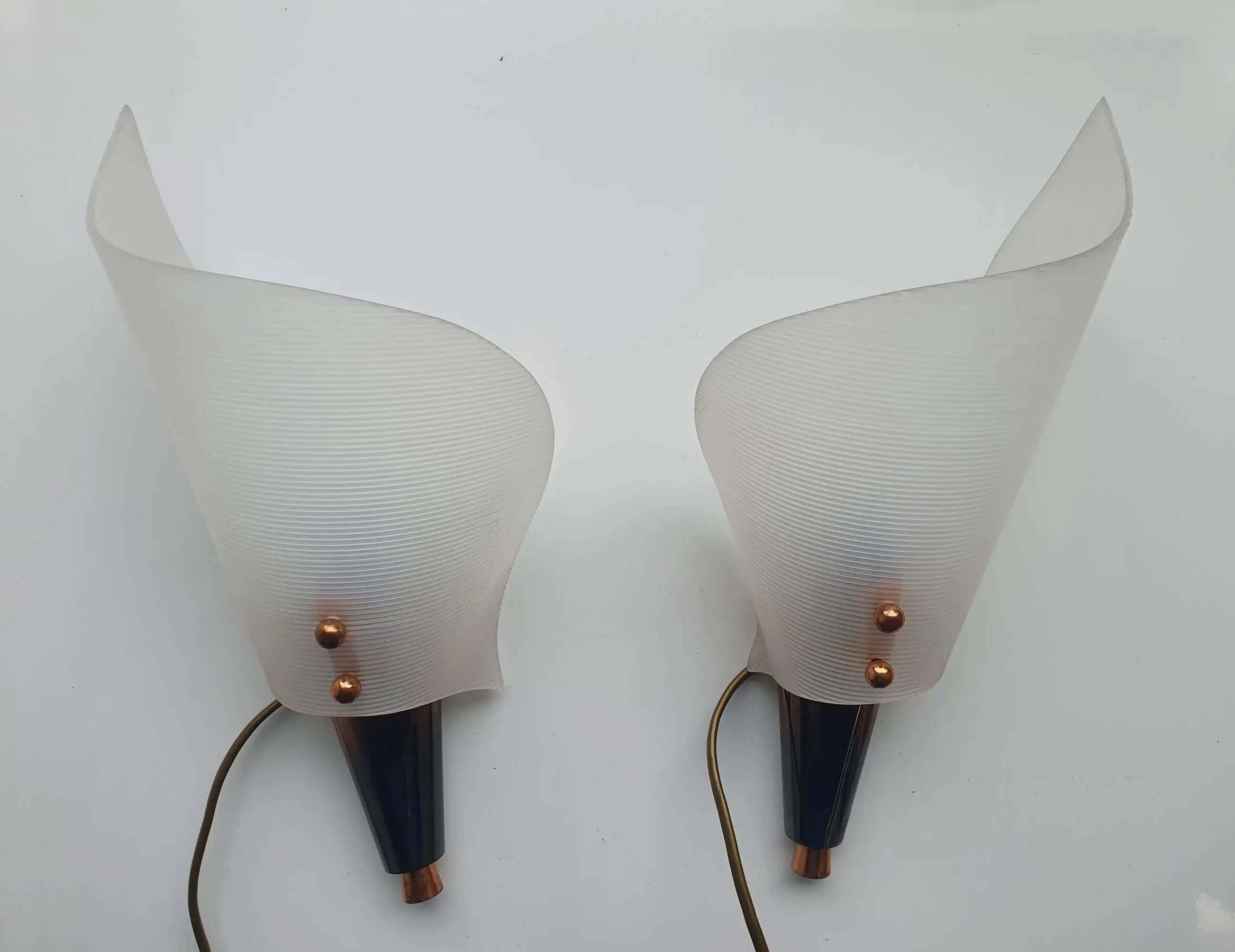 Pair of copper and plexiglass torch wall lights from the 1960s