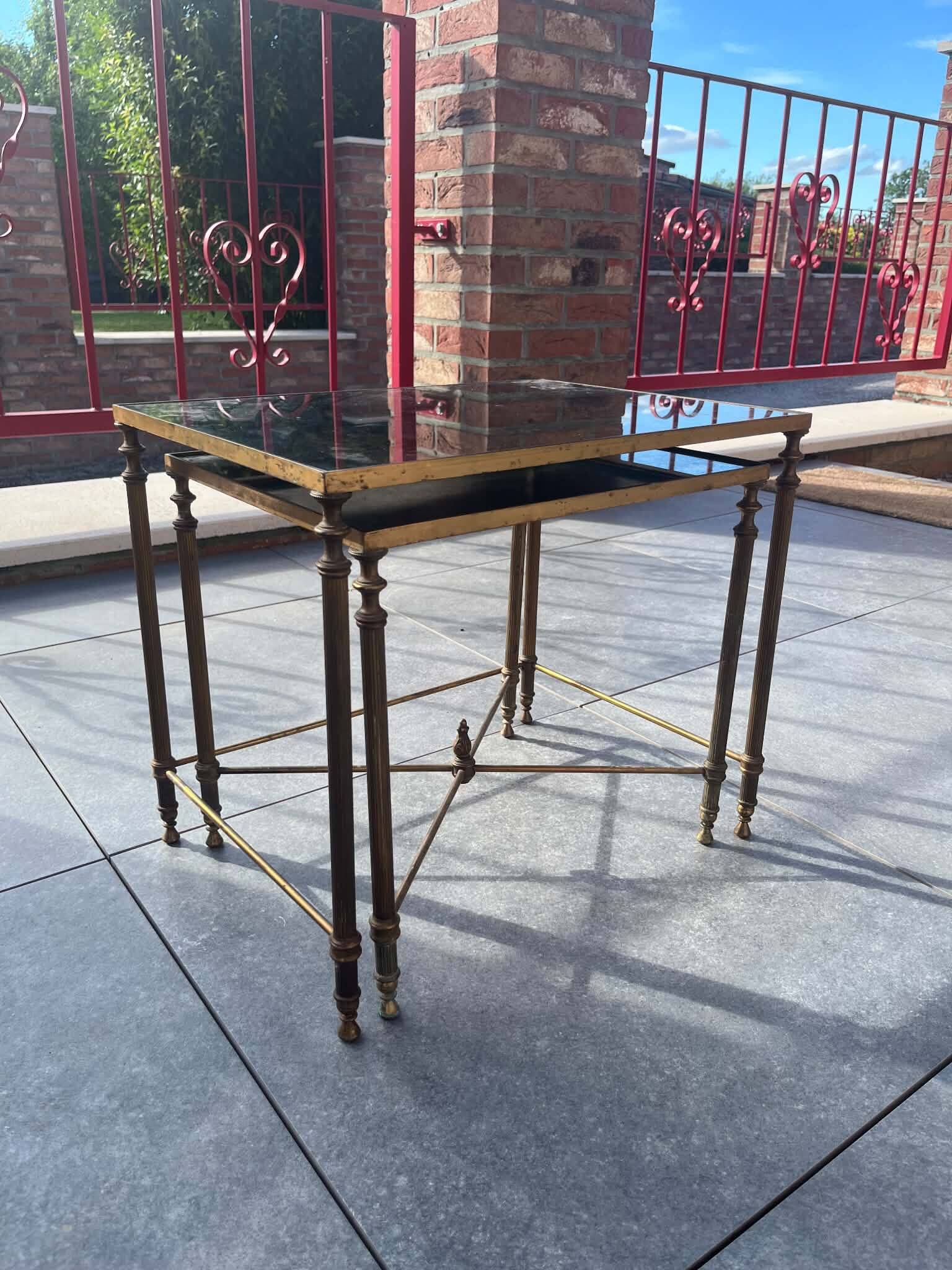 Pair of vintage nesting tables in gilded bronze and oxidised blue mirror, style
