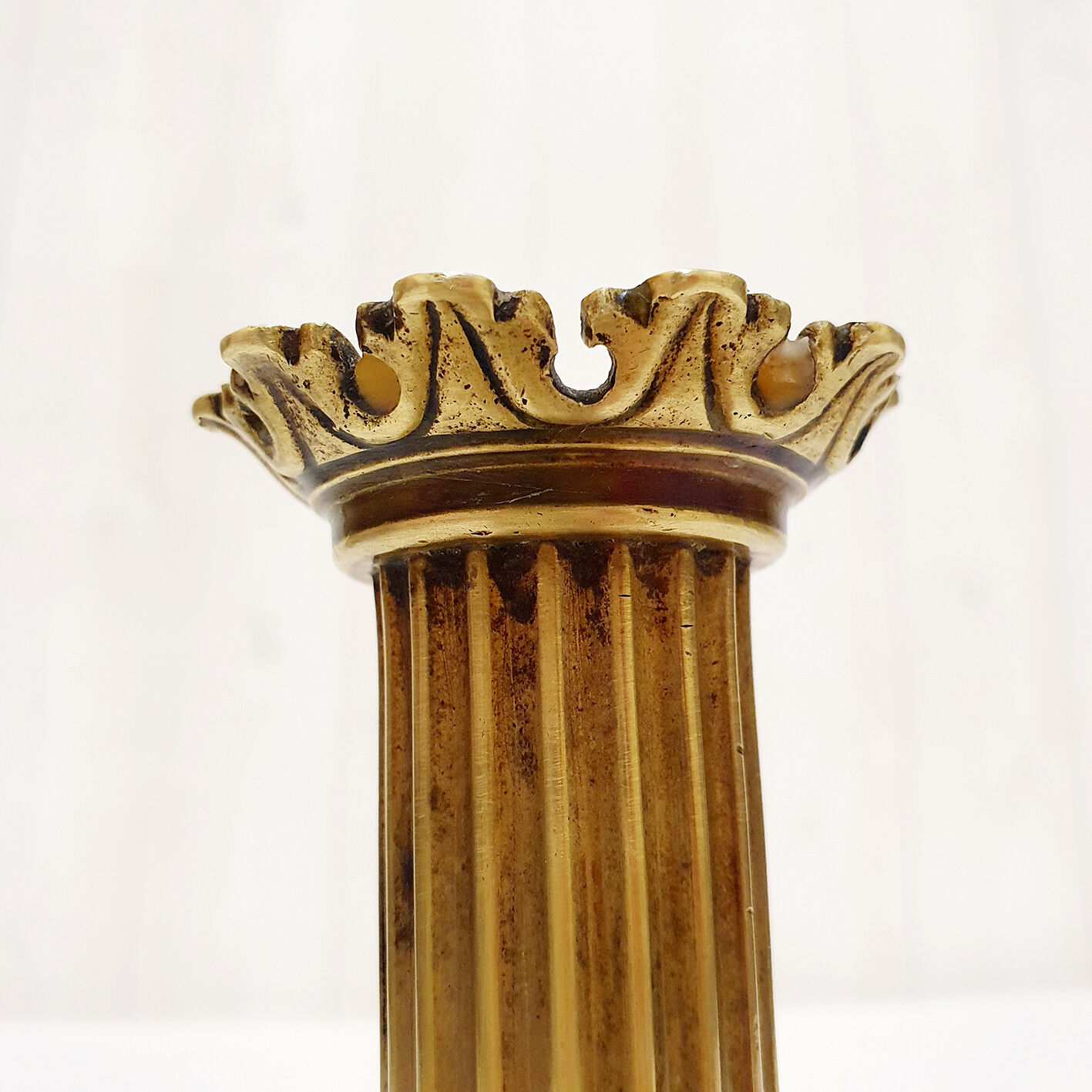 Golden candle holder with lion's head and legs