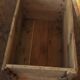 Wooden case with letters in black inck
