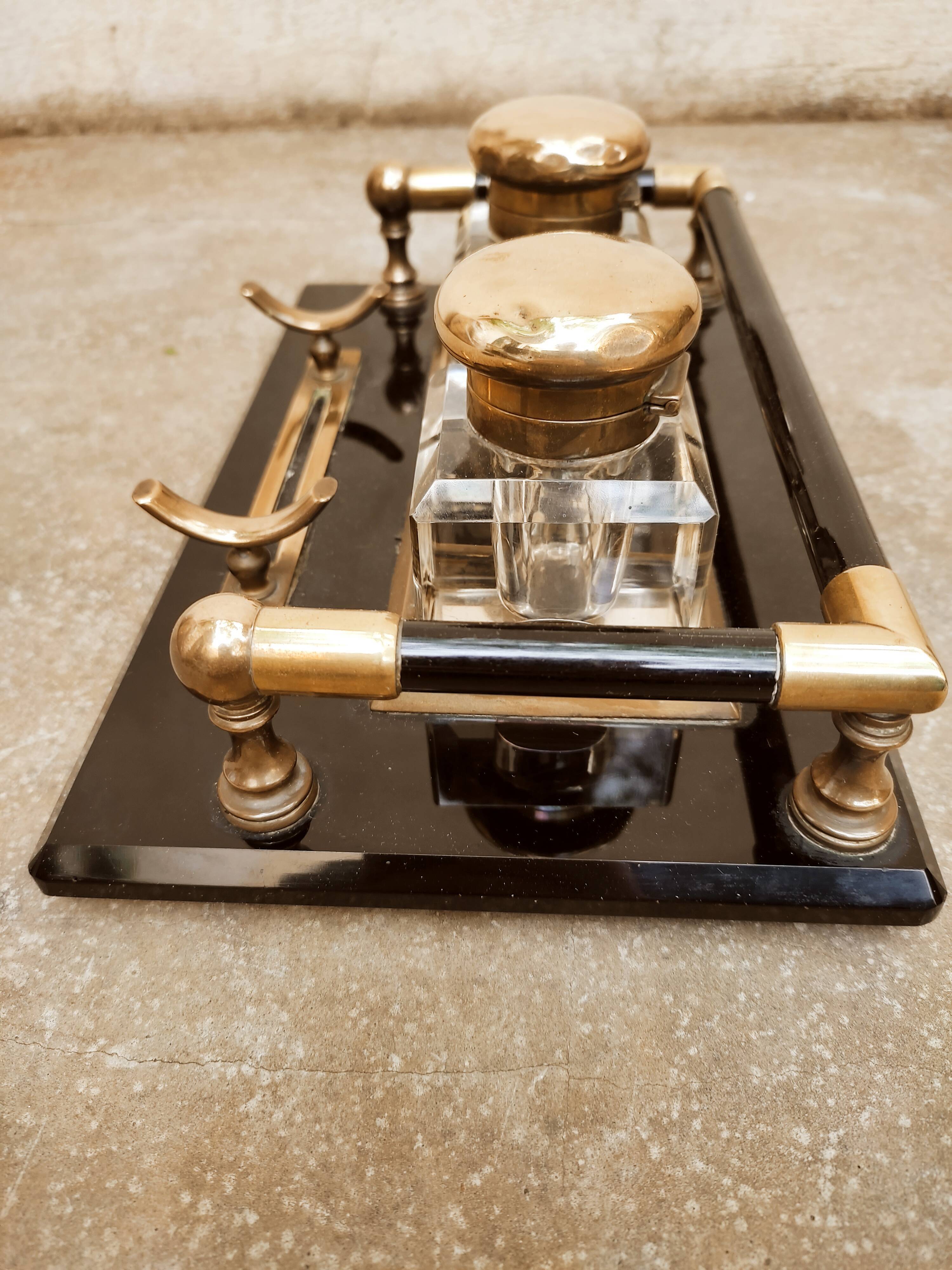 Hence the art deco inkwell on jet plate brass finishes