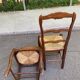 2 dining chairs with carved solid wood and rush seats in Louis XV shell style.