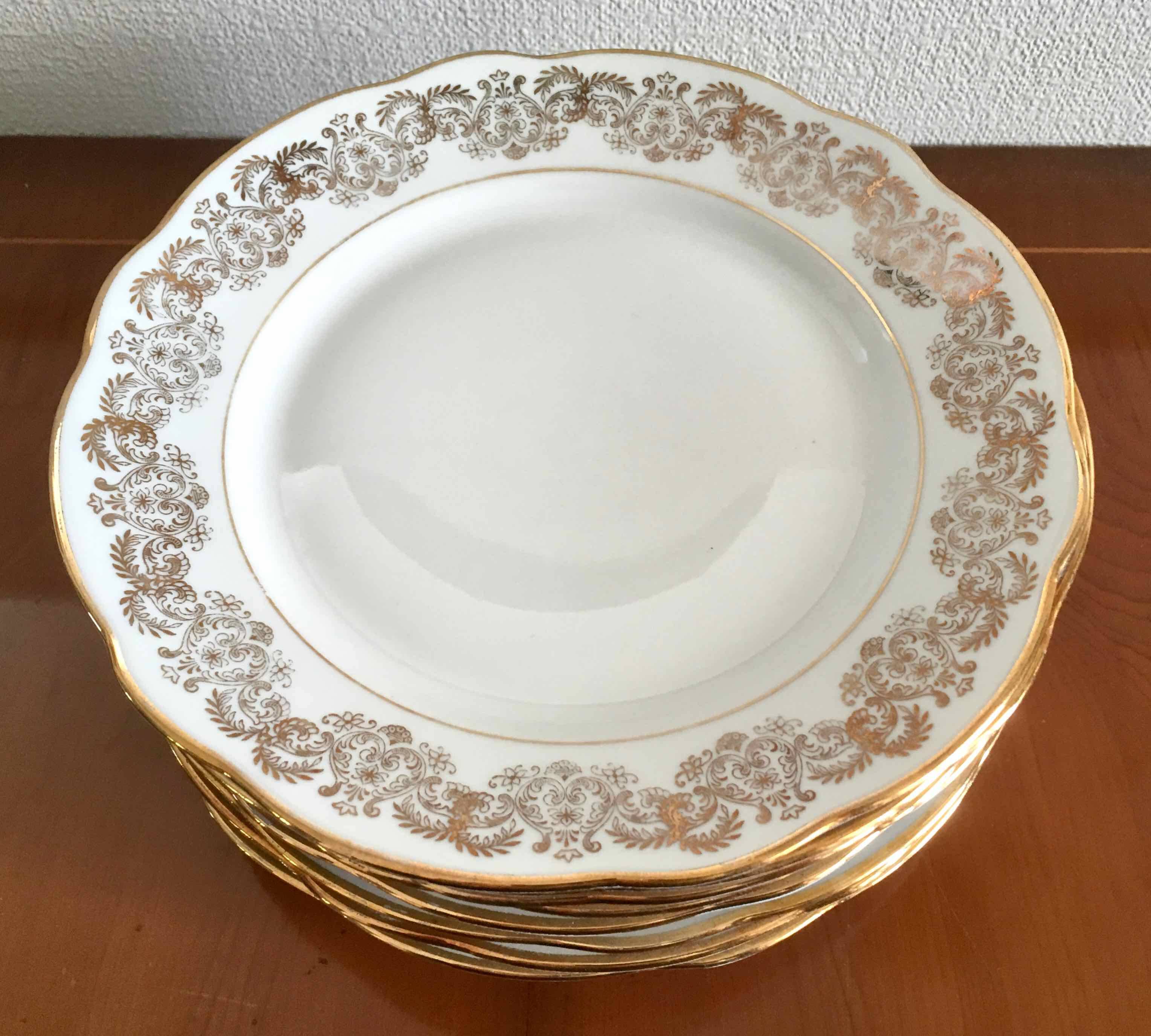 8 white and gold porcelain dessert plates
