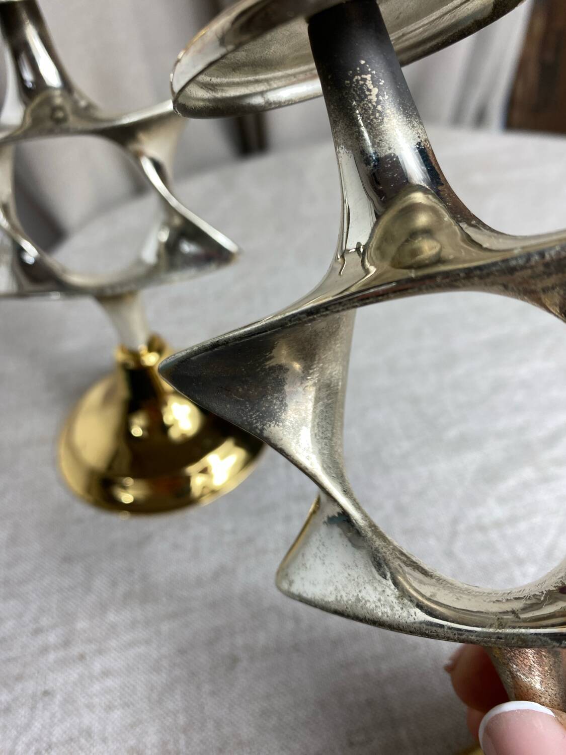 Pair of silver and gold metal candlesticks