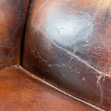 Vintage dark brown sheep leather wingback armchair
