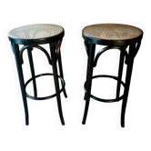 Set of 2 high bar stools made of wicker and rattan cane.