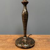 Black table lamp with paint splatters from the 1920s