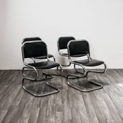 Ensemble de 4 chaises à bascule en acier chromé design années 80 vintage moderne.
