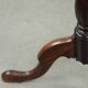 Round antique side/wine table from the late 18th century with a subtle foot