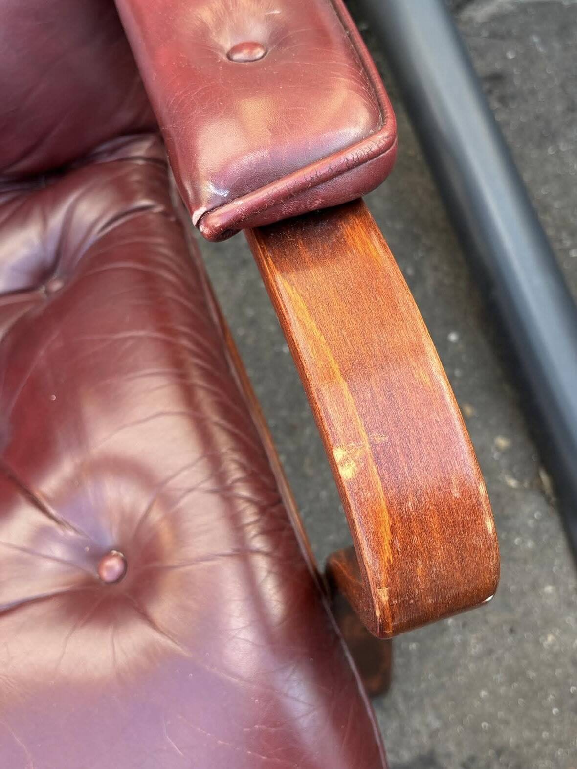 Scandinavian armchair with footrest