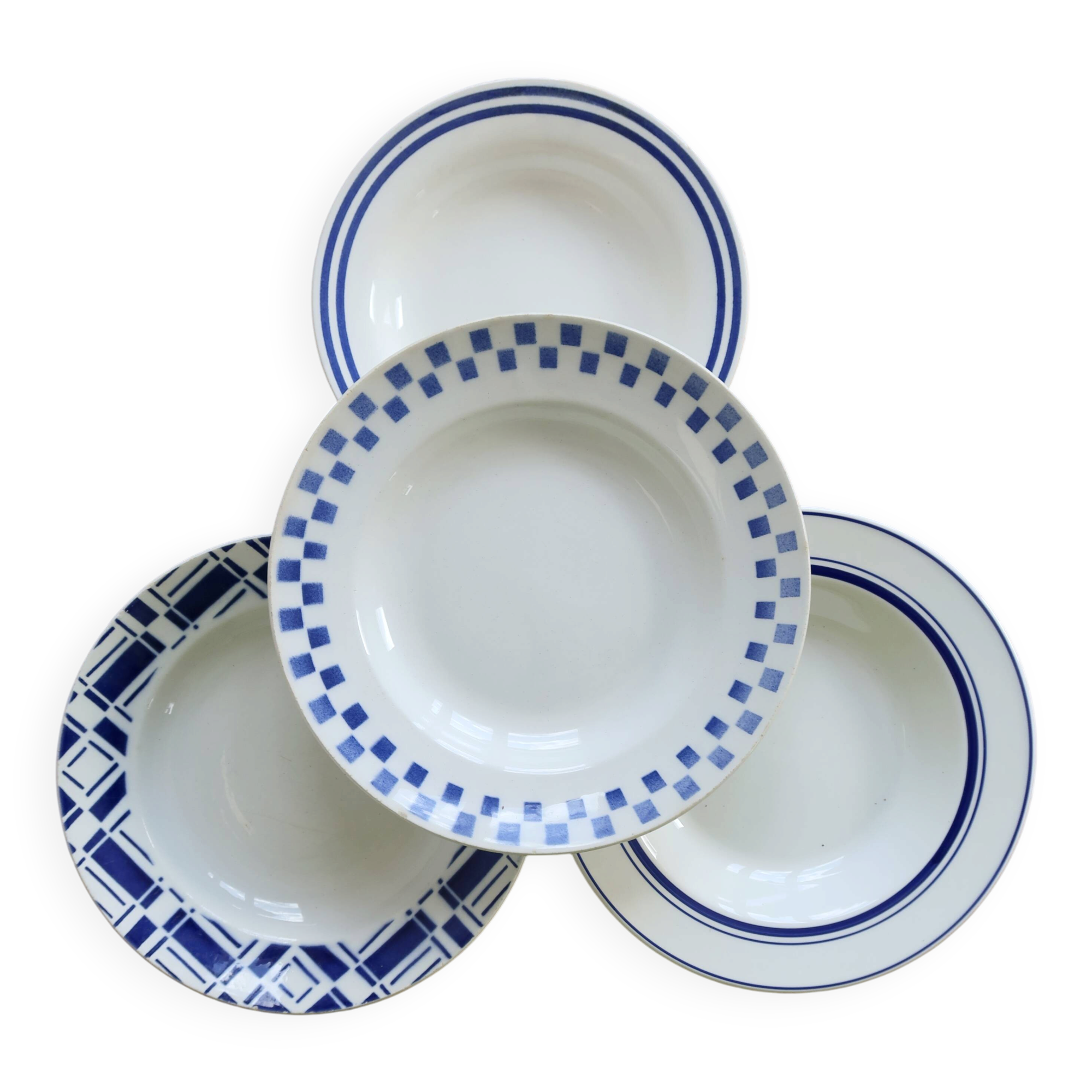 4 mismatched vintage deep plates in blue and white porcelain