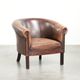 Sheepskin club armchair with patina in a subtle size and a vintage look