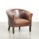 Sheepskin club armchair with patina in a subtle size and a vintage look
