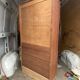 Oak two-column filing cabinet with curtains.