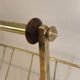 Brass and wood magazine rack, in the style of Cesare Lacca.