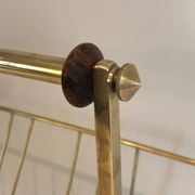 Brass and wood magazine rack, in the style of Cesare Lacca.