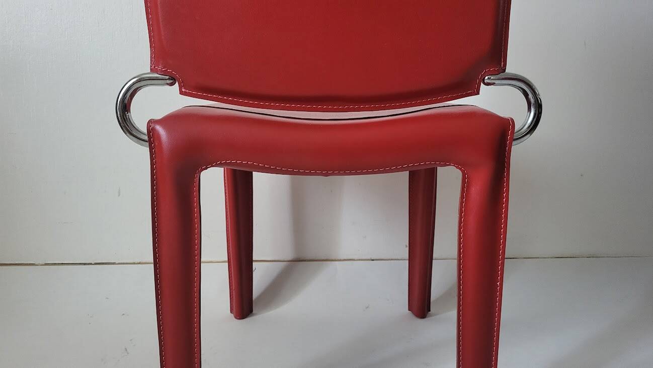 Red leather chairs by Arper