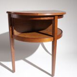 Old mahogany half-moon table with side shutters.