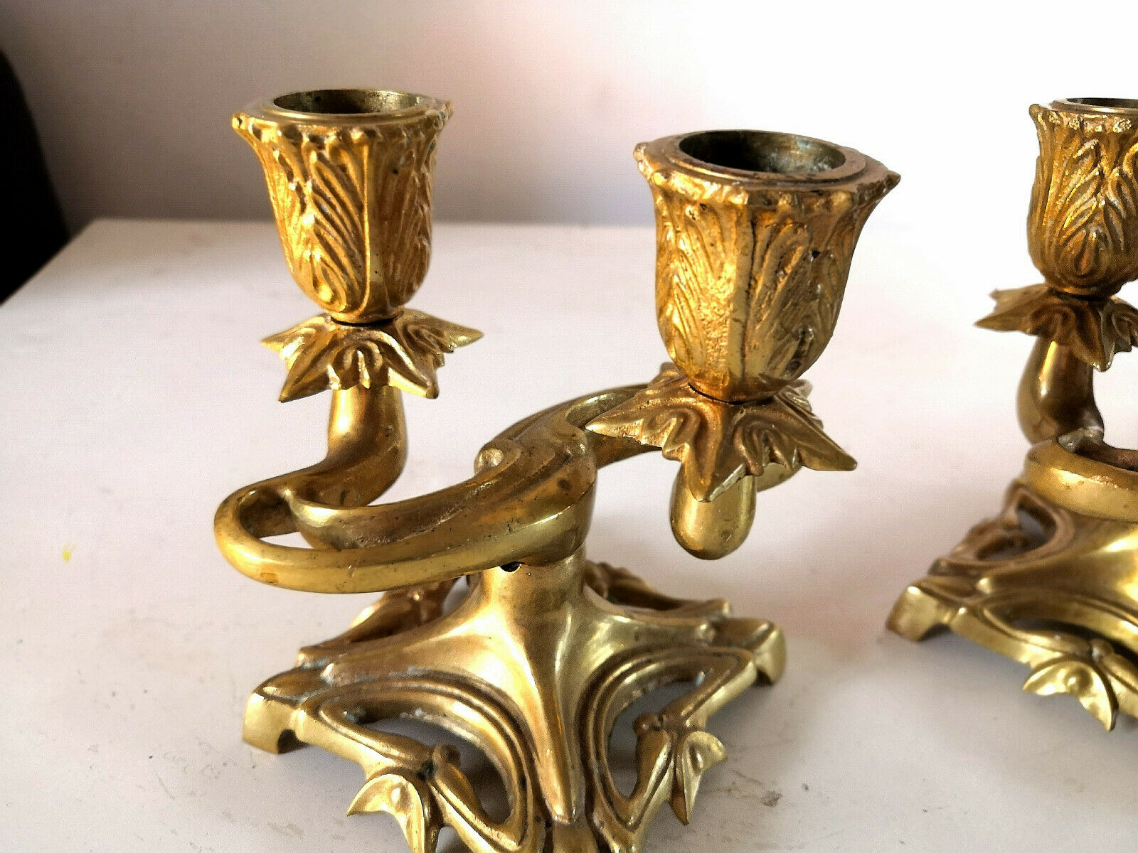 Pair of art nouveau design candlesticks in bronze