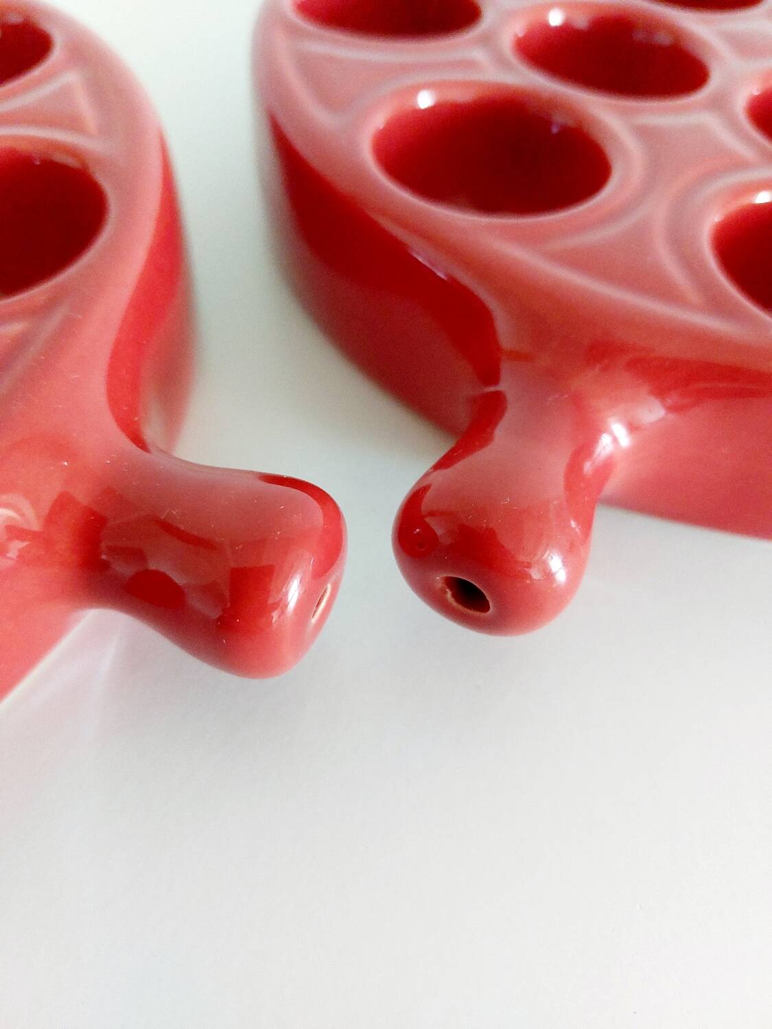 Red ceramic snail dishes