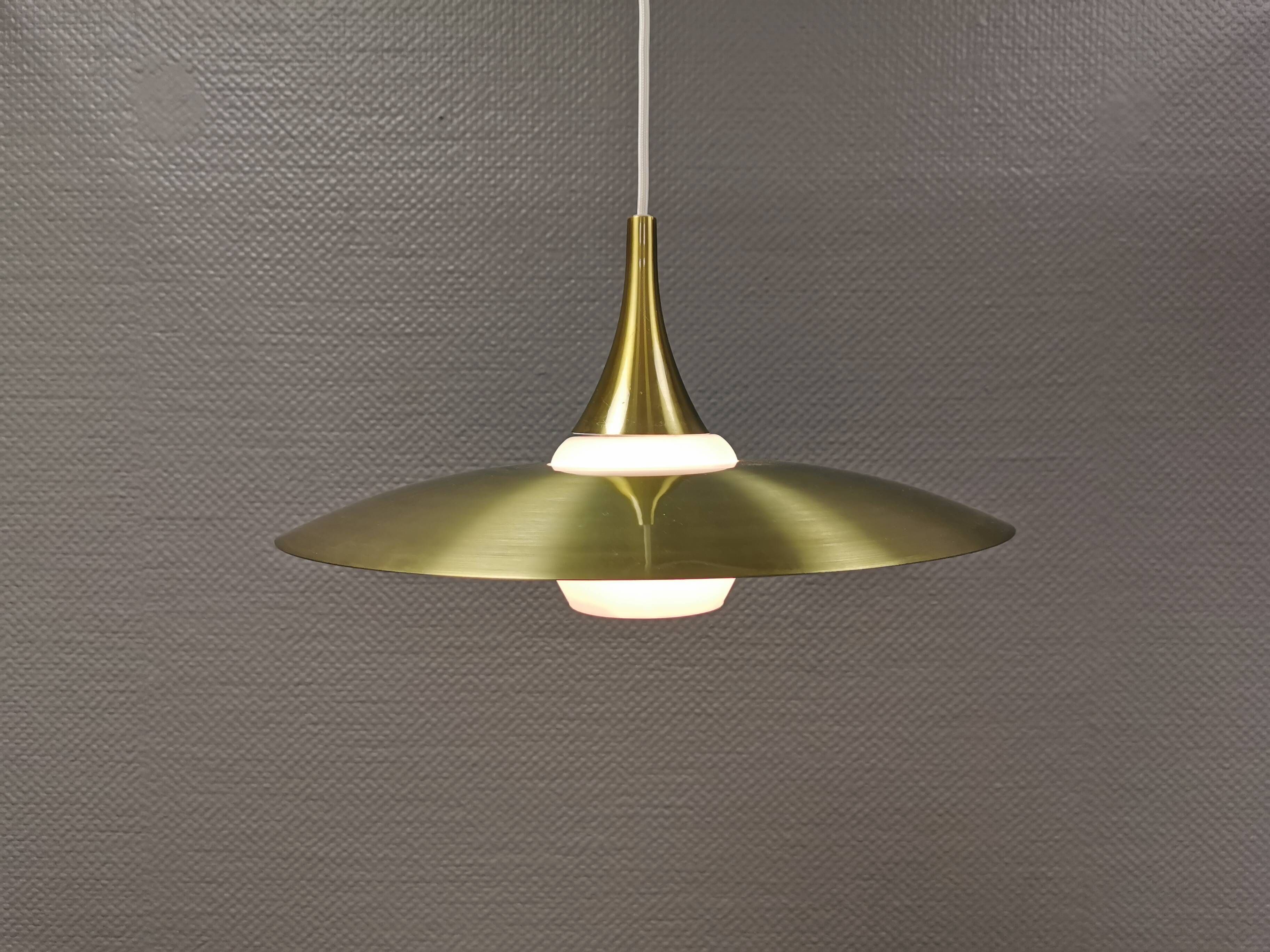 Hanging lamp, from the 1970s in matte white glass and brass colored metal.