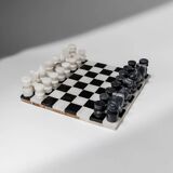 Vintage black-and-white marble chessboard with matching marble pieces, Italian 1960s design, sculptural centerpiece