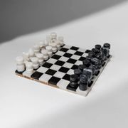 Vintage black-and-white marble chessboard with matching marble pieces, Italian 1960s design, sculptural centerpiece