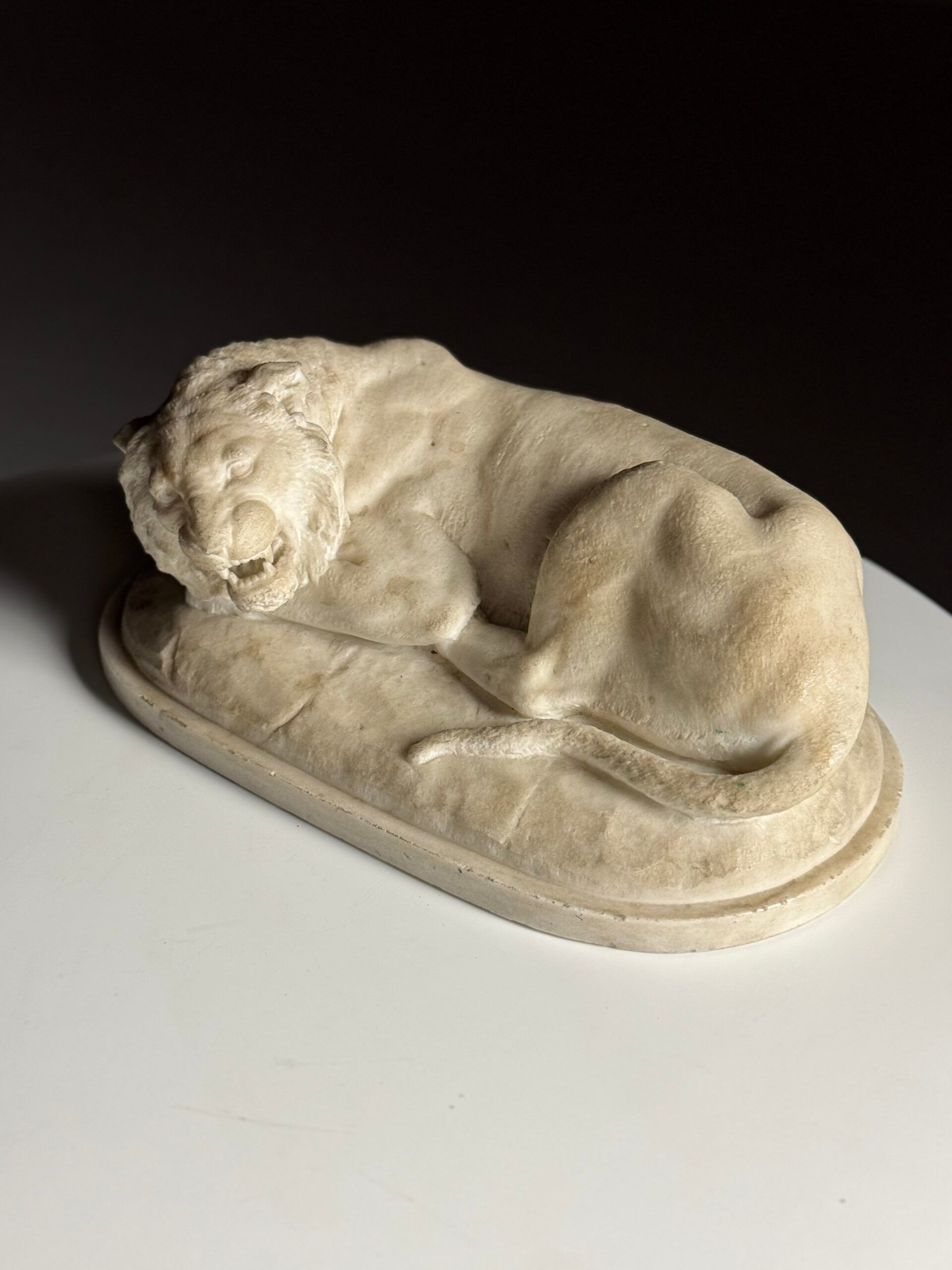 Marble sculpture of a reclining lion